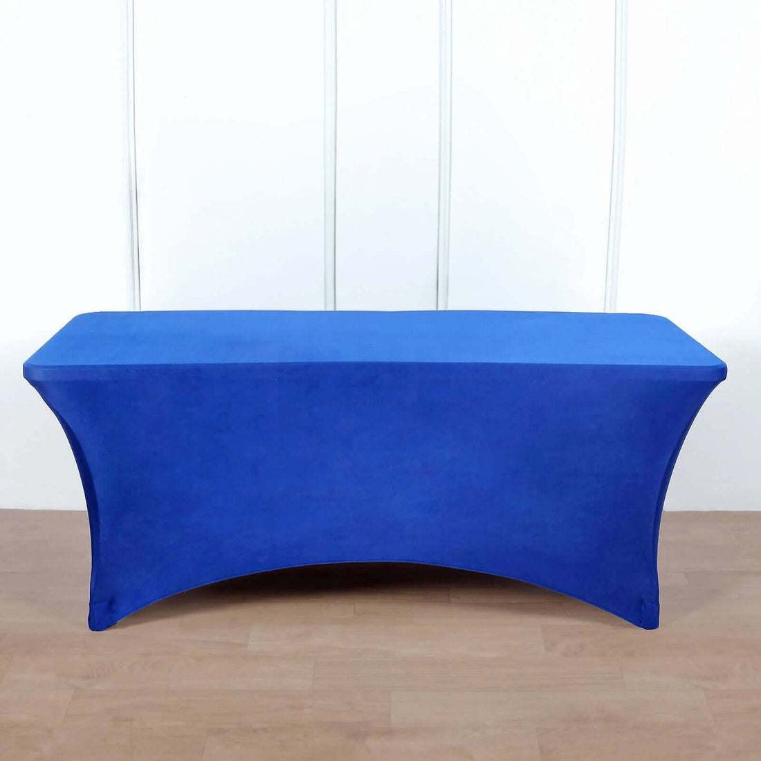 Blue table cover on a rectangular table for events or displays.