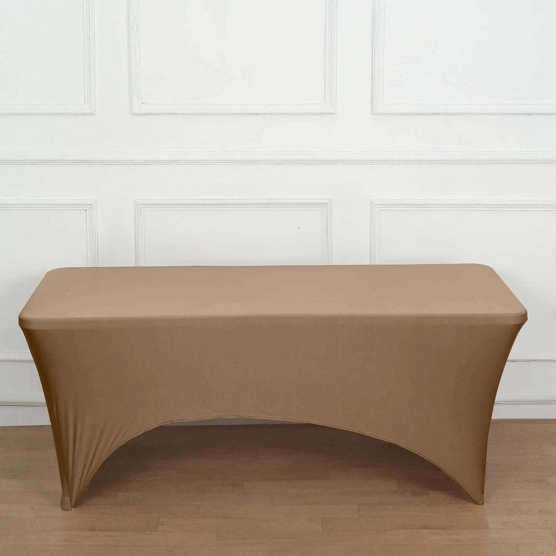 Brown stretch table cover on a plain surface.