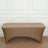 Brown stretch table cover on a plain surface.