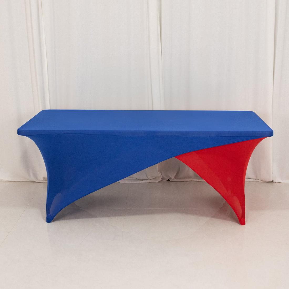 Blue and red modern table with a unique twisted design.