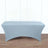Gray fitted table cover on a wooden floor.