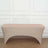 Beige stretch table cover on a plain backdrop.