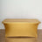 Gold table cover with elegant design and smooth finish.