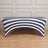 Black and white striped table cover on a wooden floor.