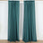 Teal curtains hanging on a rod against a white background