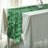 Green leaf-patterned table runner on a white table.