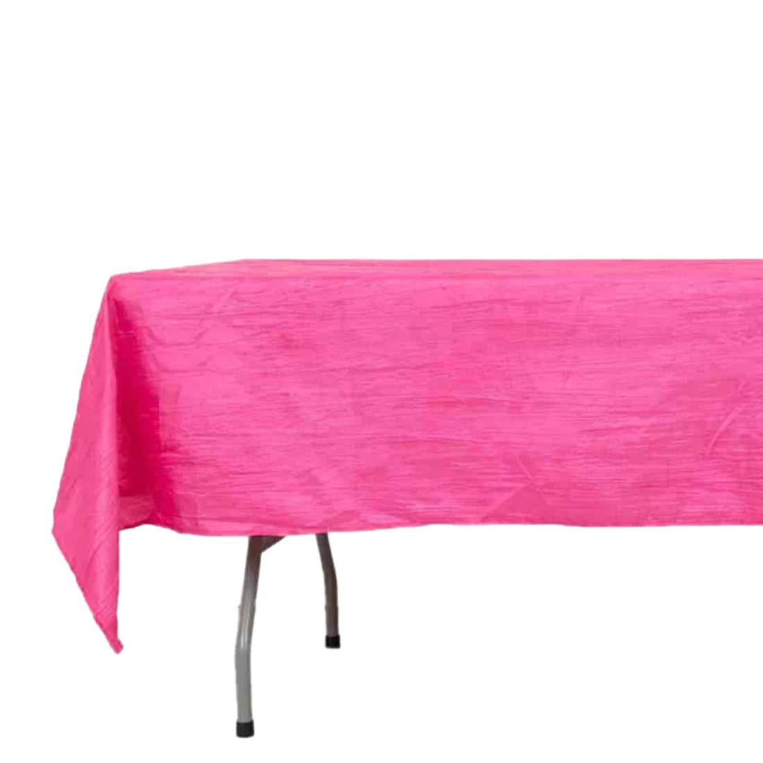 Bright pink tablecloth on a table with a textured finish.