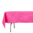 Bright pink tablecloth on a table with a textured finish.