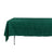 Green tablecloth draped over a table on a plain background