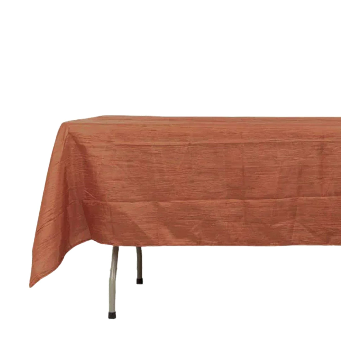 Orange tablecloth draped over a table, showcasing textured fabric.
