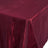 Burgundy tablecloth with a textured finish on a plain background