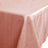 Pink tablecloth with a smooth, textured finish.