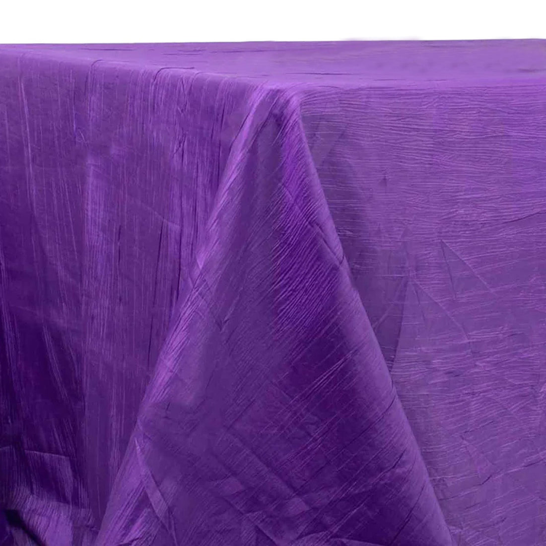 Purple tablecloth with a textured finish draped elegantly.
