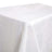 White tablecloth with a textured finish draped over a table.