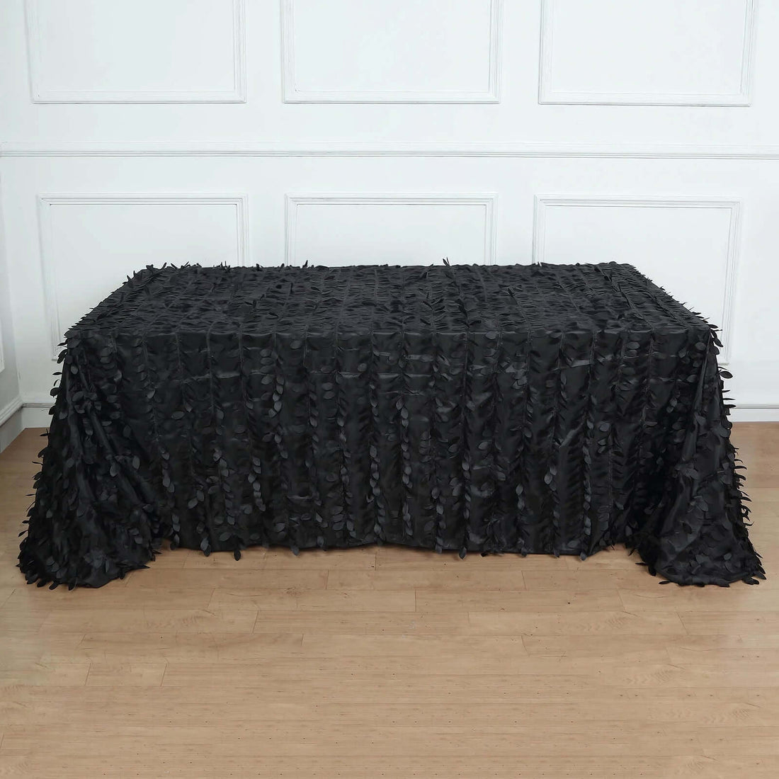 Black ruffled tablecloth on a rectangular table