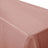Pink tablecloth draped over a table, showcasing its smooth texture.