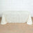 White tablecloth with floral appliqué design draped over a table