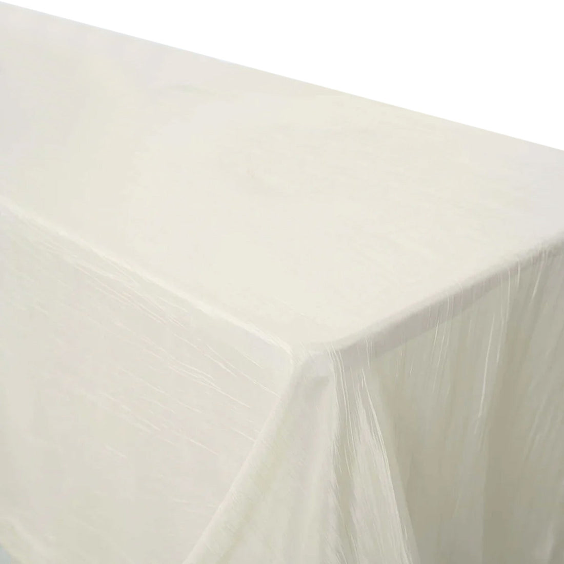 White tablecloth draped over a table on a plain background