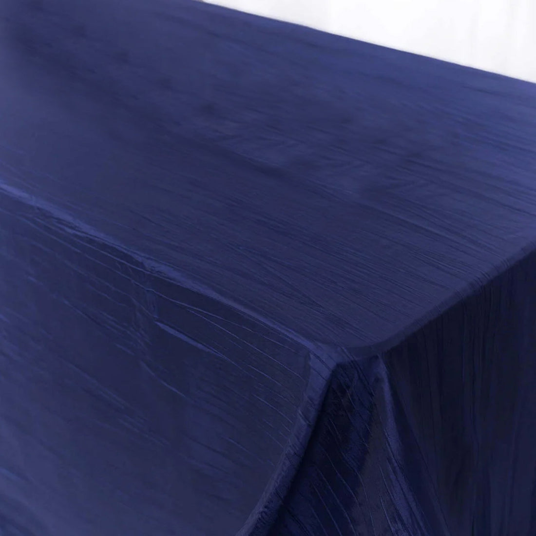 Navy blue tablecloth with a textured finish on a white background