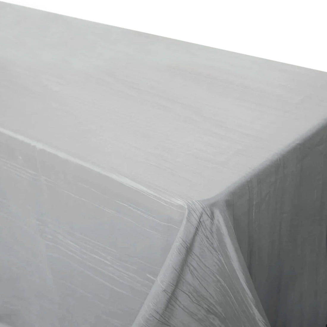 Clear plastic table cover on a gray table surface