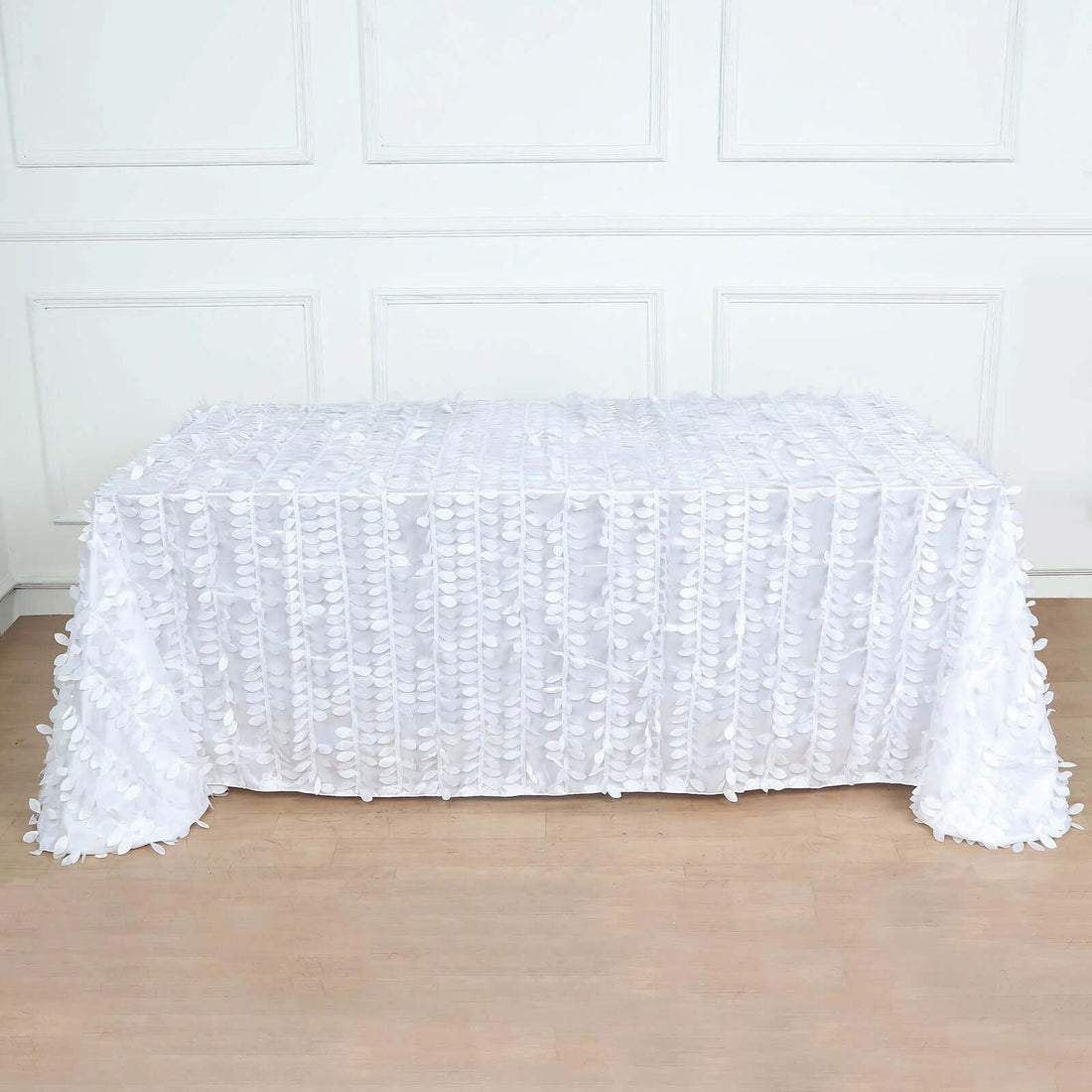 White tablecloth with textured design on a table.