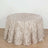 Textured cream tablecloth with leaf appliqués for elegant decor.