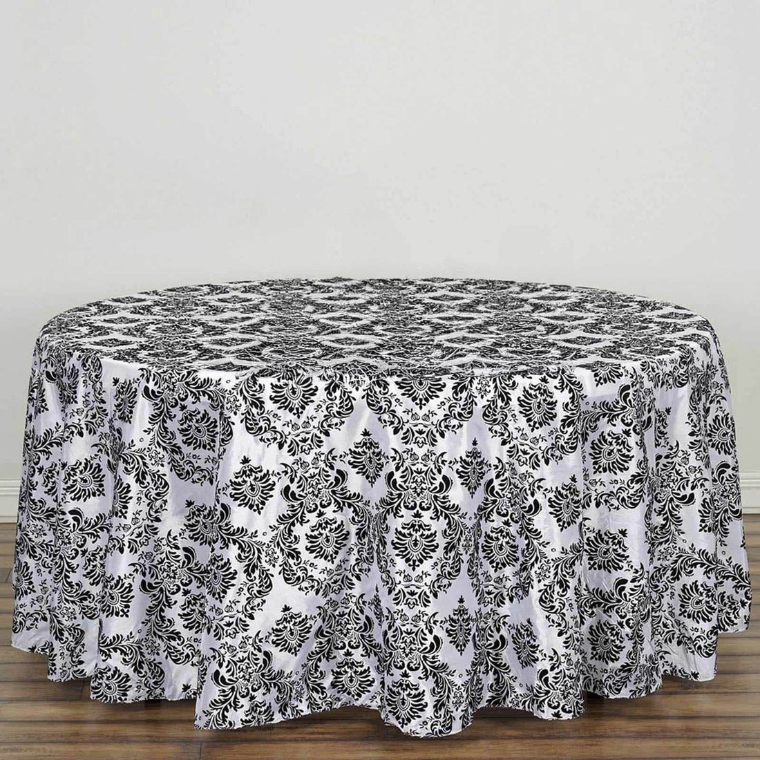 Black and white damask print tablecloth for round tables.