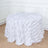 White tablecloth with leaf design draping over a round table.