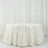 White tablecloth with textured floral design draping elegantly.