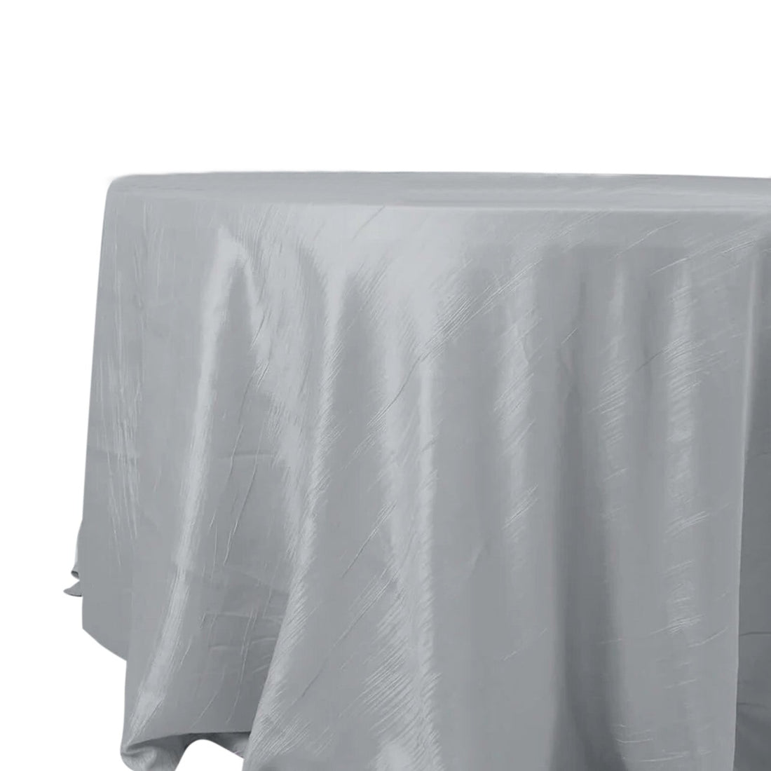 Silver round tablecloth on a plain backdrop