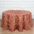 Rose gold sequin tablecloth draped over a round table.