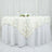 Elegant white tablecloth with textured leaf design, perfect for special occasions.