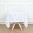 White tablecloth with textured circular accents on a plain backdrop