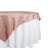 Rose satin tablecloth draped elegantly over a white table. 