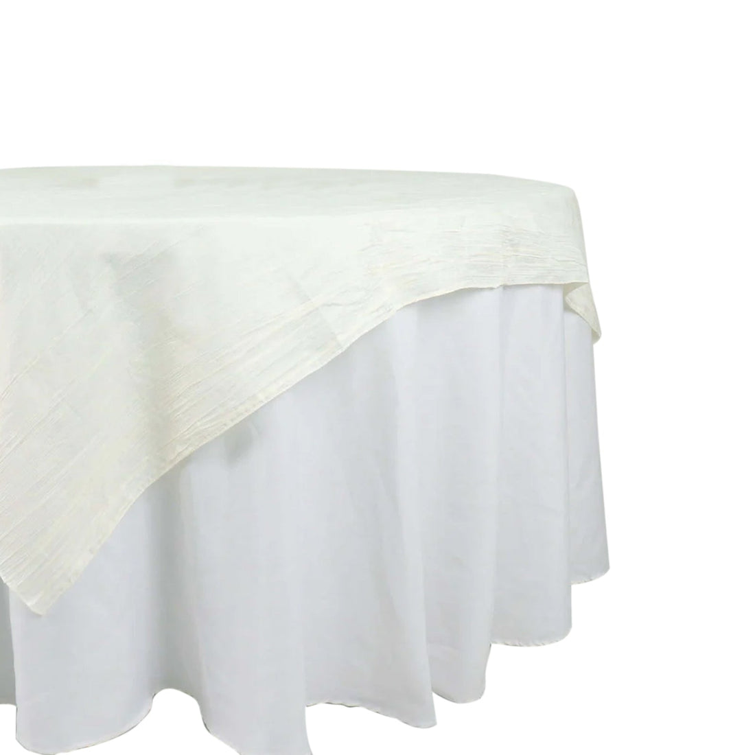 Round white tablecloth with a textured design on a plain background. 