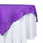 Purple tablecloth draped over a white table. 