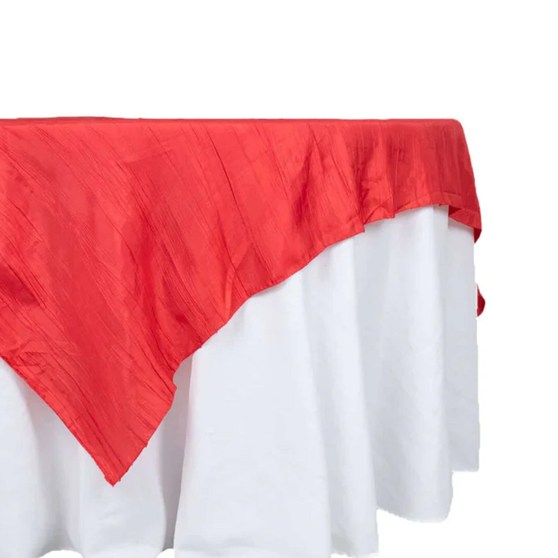 Red tablecloth draped over a white table, showcasing elegant fabric texture. 
