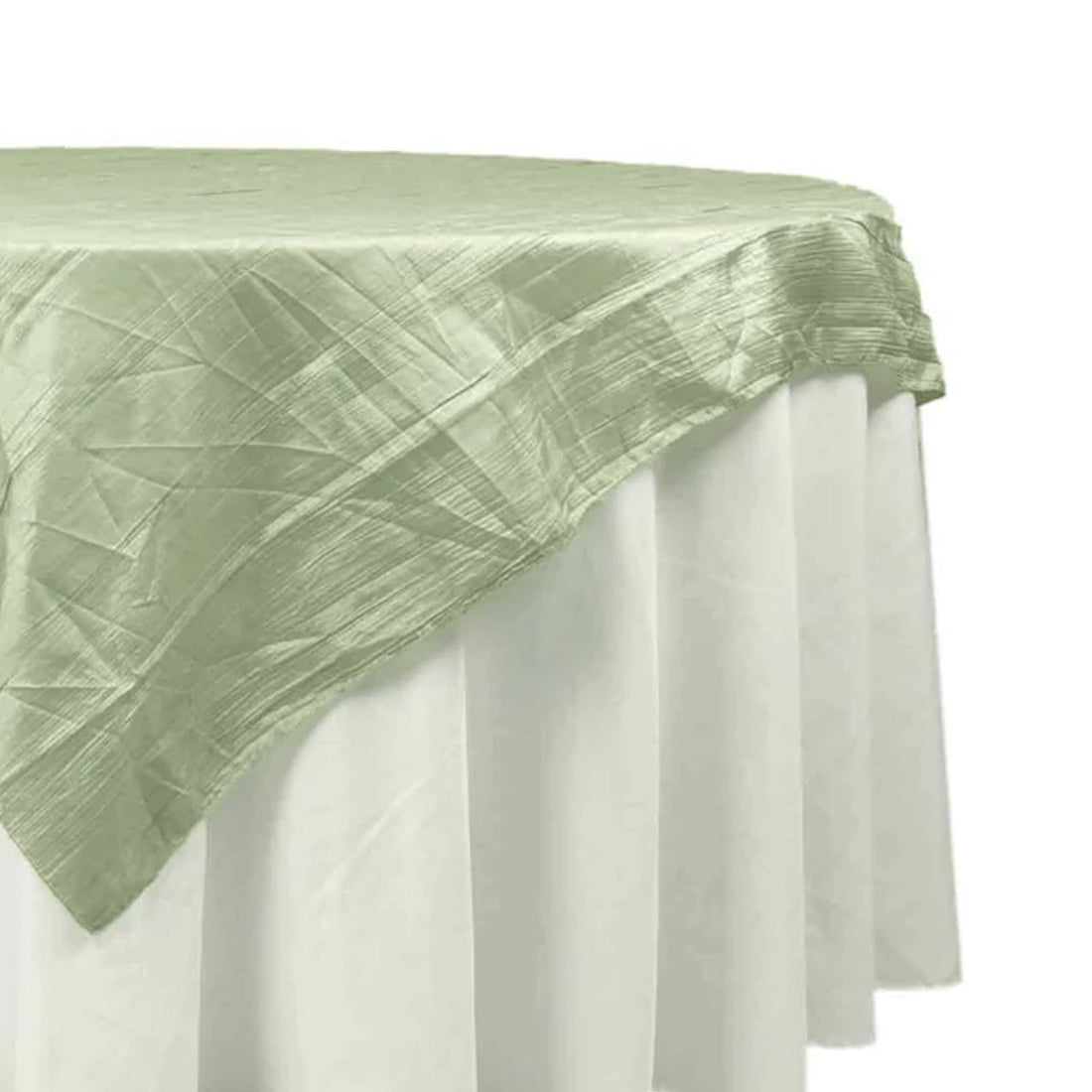 Light green tablecloth draped elegantly over a white table. 