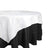 White tablecloth draped over a black tablecloth, showcasing elegant layering.