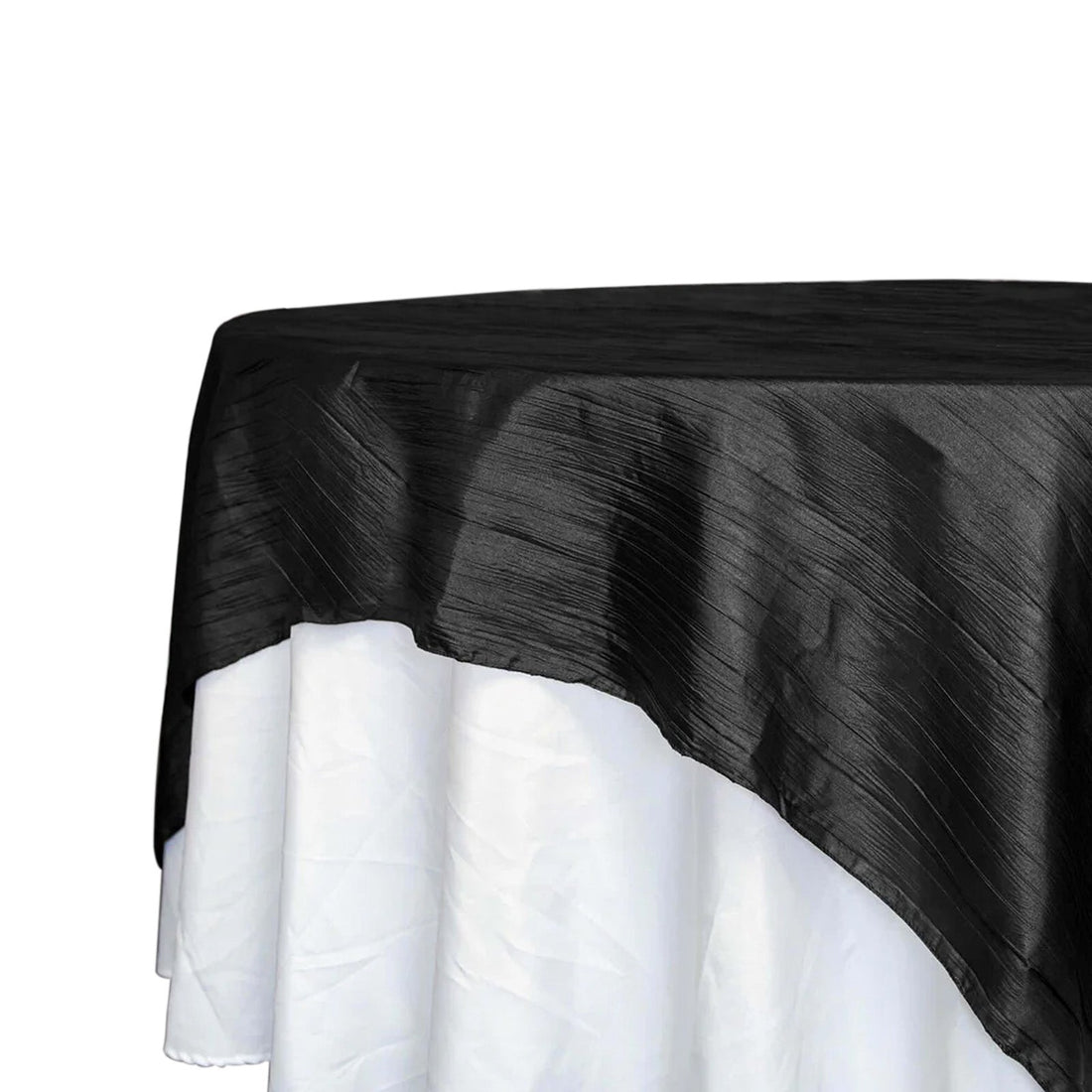 Black tablecloth draped over a white table, showcasing elegant texture. 