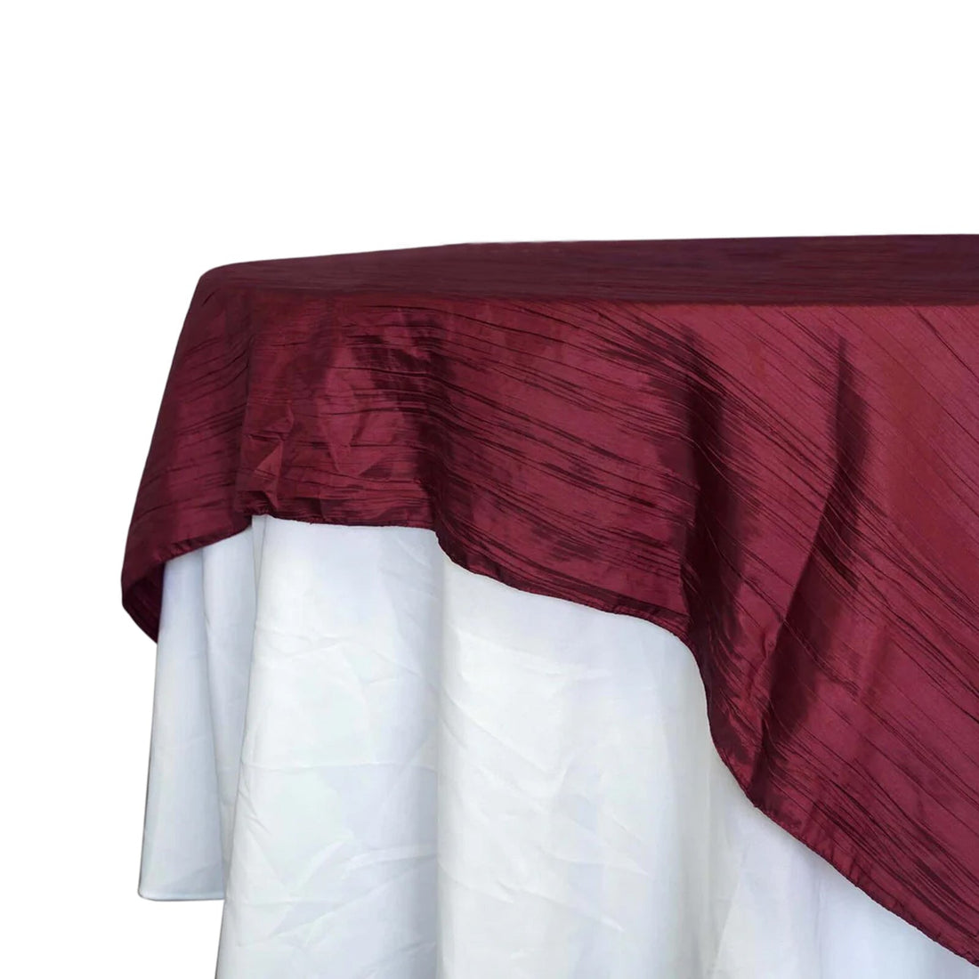 Burgundy tablecloth draped elegantly over a white table. 