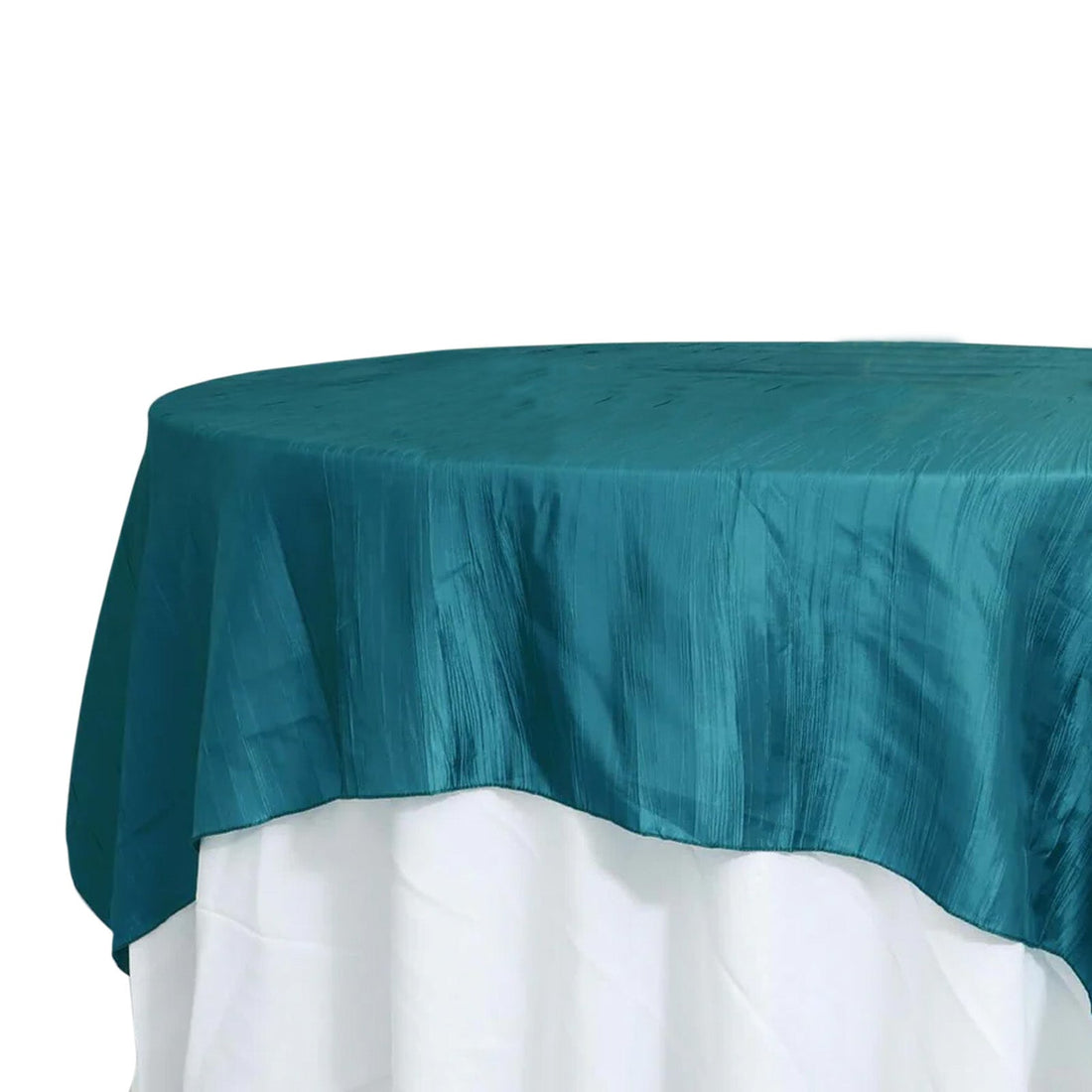 Teal round tablecloth on a white table 