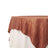 Brown textured tablecloth draped elegantly over a white table. 