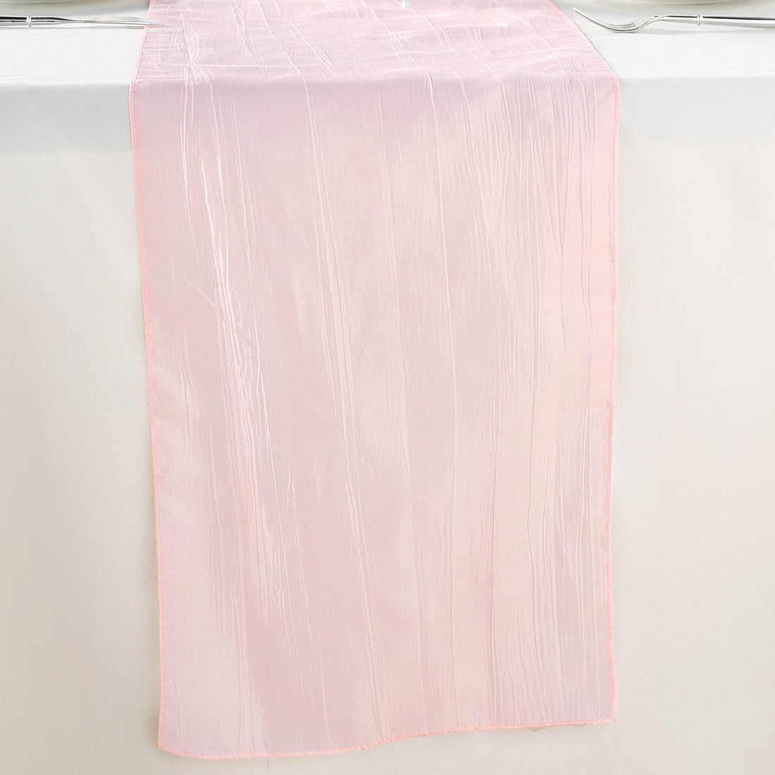 Pink sheer table runner with a subtle striped texture.