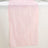 Pink sheer table runner with a subtle striped texture.