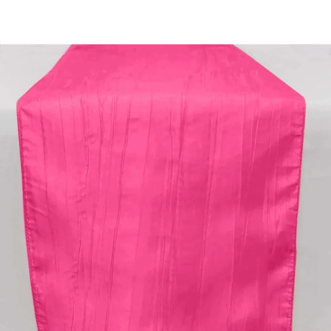 Bright pink table runner with a textured striped design