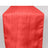 Red table runner with textured stripes, perfect for elegant dining settings.