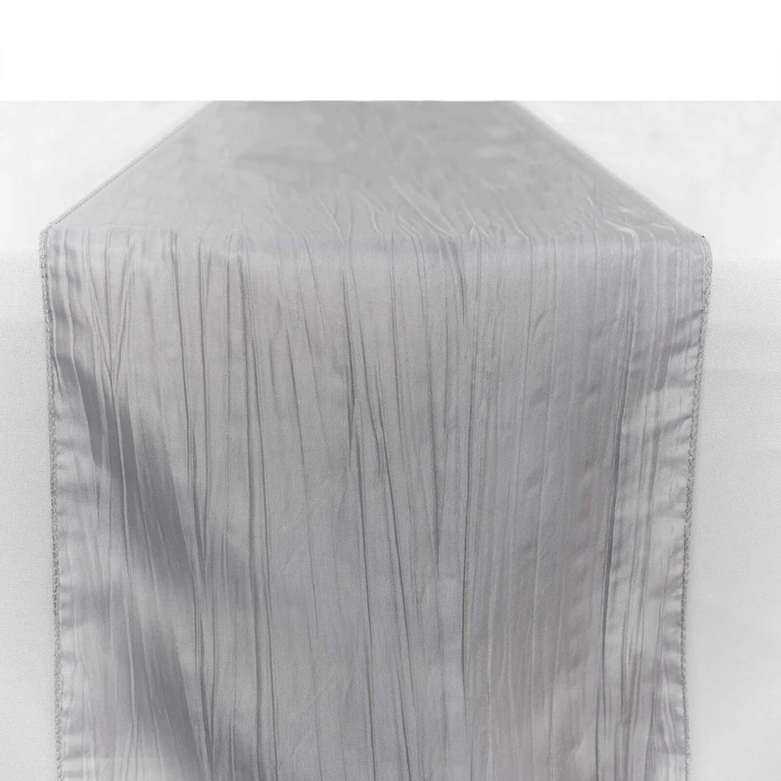 Silver textured table runner on a plain backdrop.