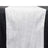 White pleated table runner on a black surface