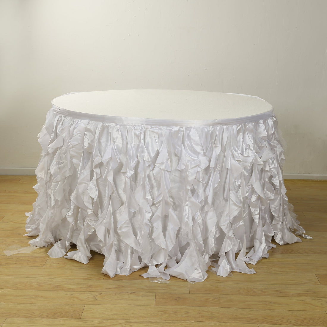 White ruffled table skirt for events and parties